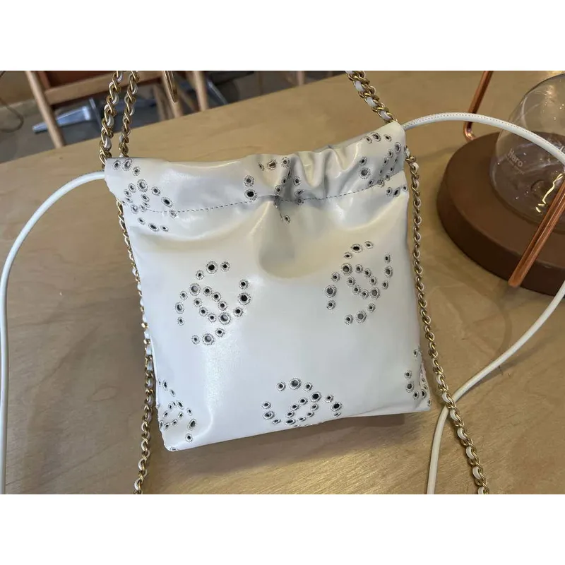 Chanel 22 Mini Handbag  Shiny Calfskin & Gold Tone Metal AS3980 White