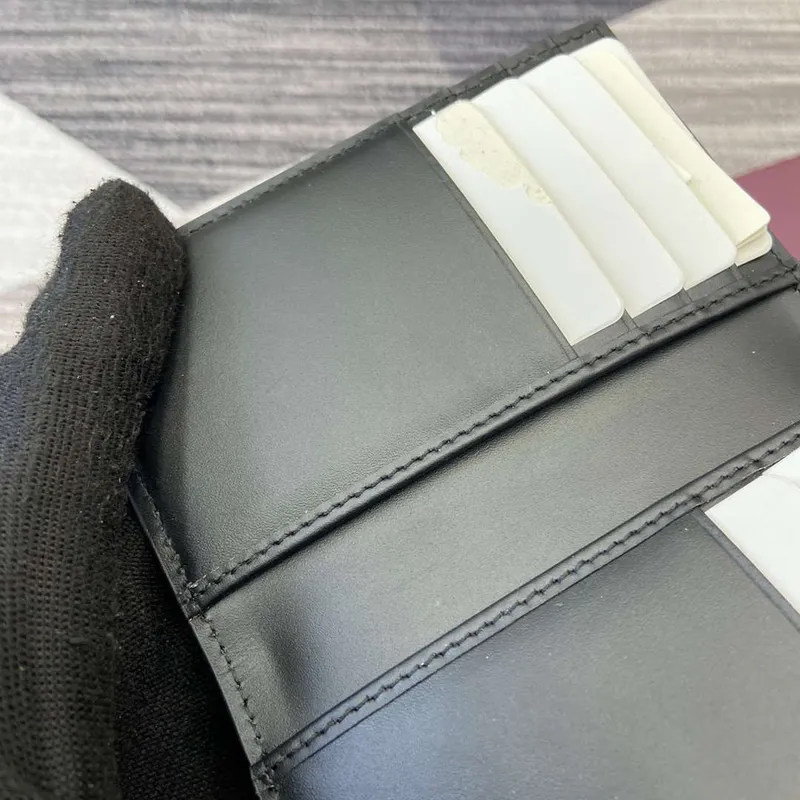 Gucci 821209 GG Emblem bi fold card case Black