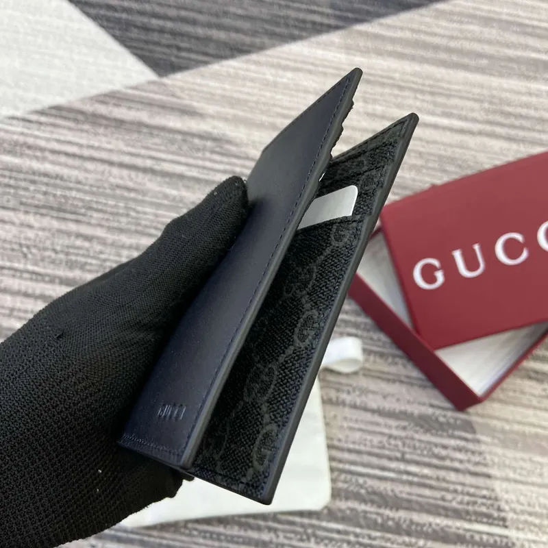 Gucci 818953 GG Emblem bi fold embossed card case Black