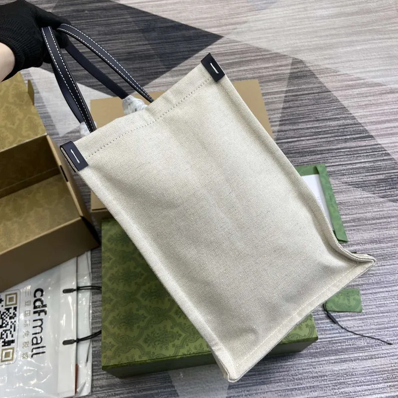 Gucci 772176 Medium Tote Bag With Gucci Print Black leather trim