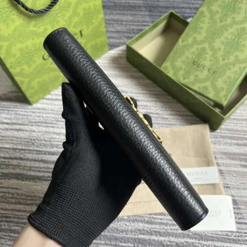 Gucci 750458 Zip wallet with Interlocking G python bow Black