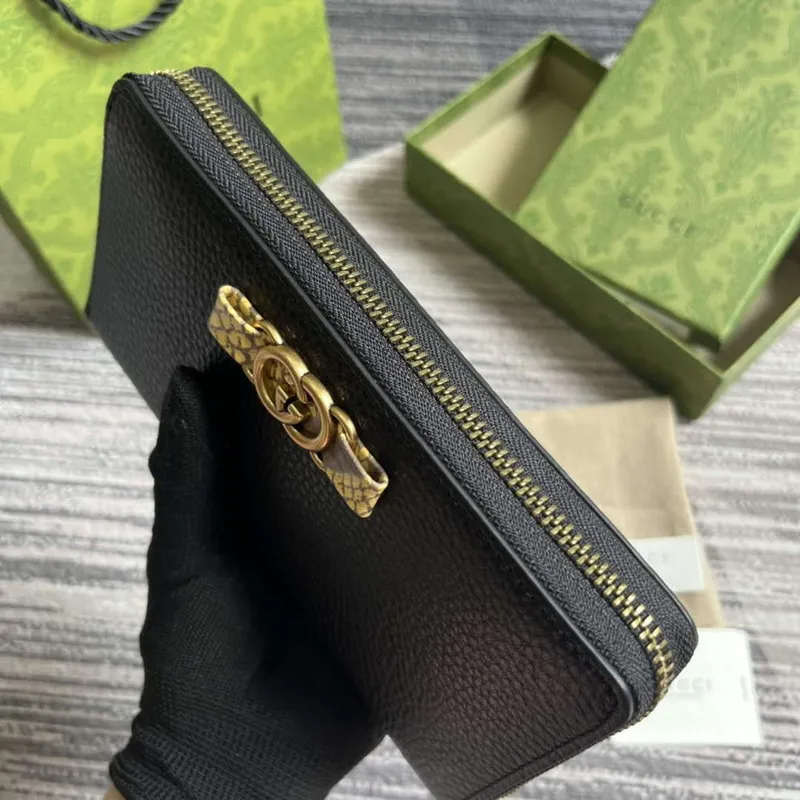 Gucci 750458 Zip wallet with Interlocking G python bow Black