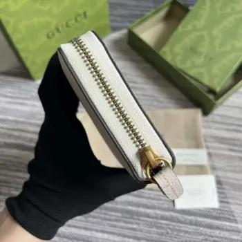 Gucci 750458 Zip wallet with Interlocking G python bow White