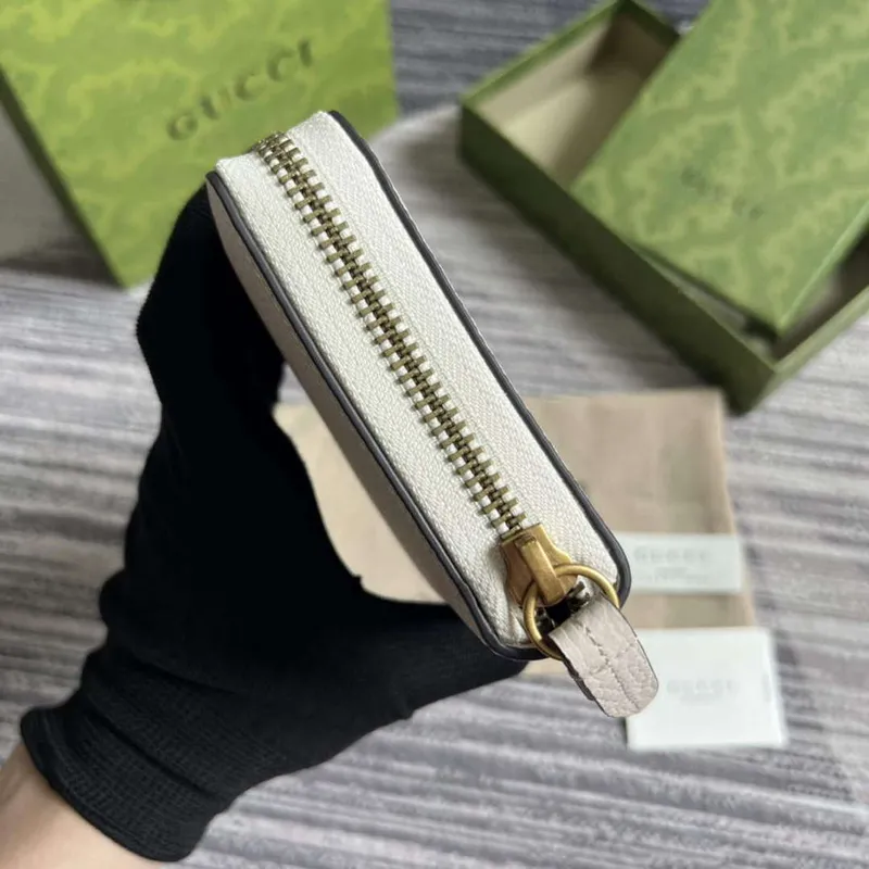 Gucci 750458 Zip wallet with Interlocking G python bow White