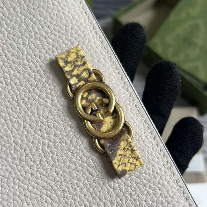 Gucci 750458 Zip wallet with Interlocking G python bow White