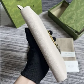 Gucci 750458 Zip wallet with Interlocking G python bow White