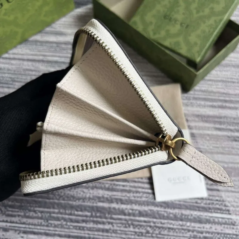 Gucci 750458 Zip wallet with Interlocking G python bow White
