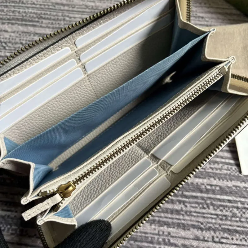 Gucci 750458 Zip wallet with Interlocking G python bow White