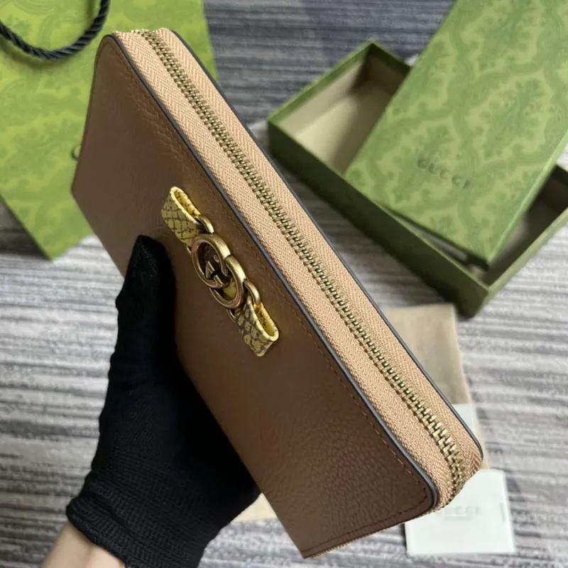 Gucci 750458 Zip wallet with Interlocking G python bow Rose beige