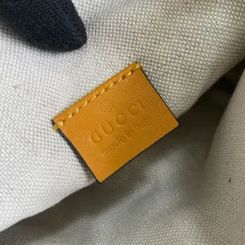 Gucci 658582 GG embossed belt bag Yellow GG embossed leather