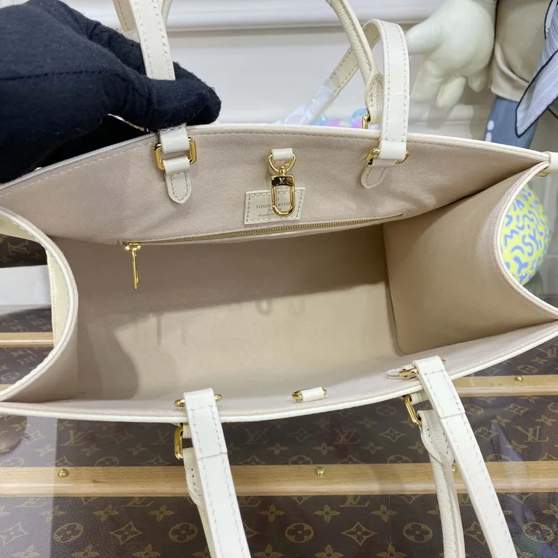 LV M21575 Louis Vuitton OnTheGo MM Bicolor Monogram Empreinte Leather Latte Pink