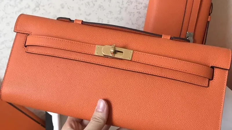 Hermes Orange Epsom Kelly Cut: Handcrafted Elegance in a Compact Silhouette