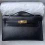 Kelly Pochette Handmade Bag In Black Chevre Mysore Leather